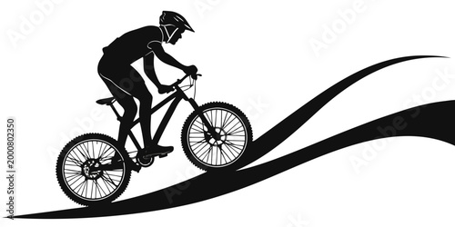 Photos Mountain biker performing a wheelie while riding uphill graphic black and white