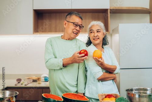 Fotografie Happy Senior Couple Choosing Healthy Food