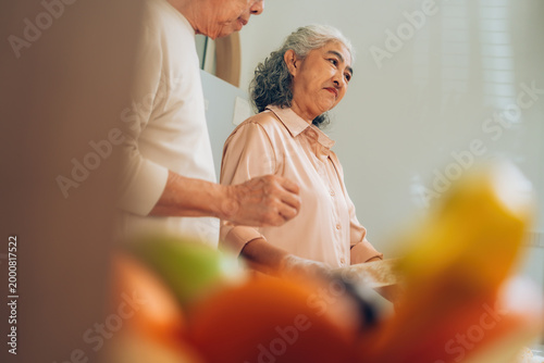 Senior Couple Baking Together at Home Kitchen