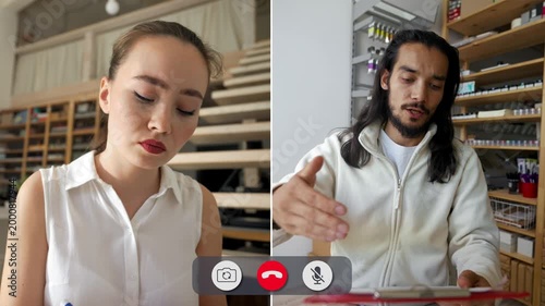 Students take part in an online call for class. One student writes notes while showing concentration, and the other student explains ideas with gestures.