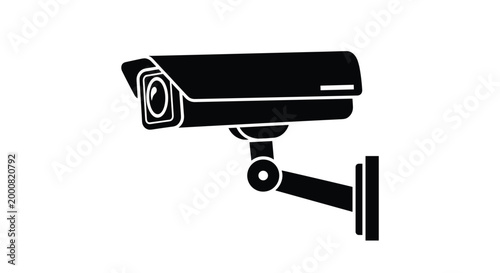 Sharp black silhouette of a wall-mounted security surveillance camera used for monitoring and safety in residential or commercial buildings.