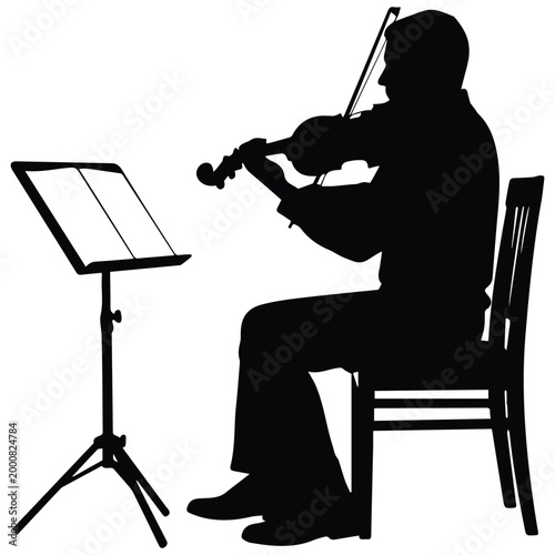 Foto Musician silhouette playing violin with a music stand