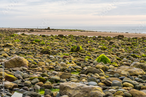 Stones on the beach and the ST Pasages Shipwreck between Ballasalla and Sartfield, Isle of Man