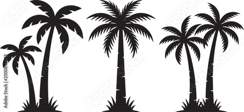 Four black palm trees on grassy mound