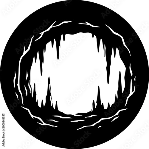 Black and white circular cave entrance icon with stalactites