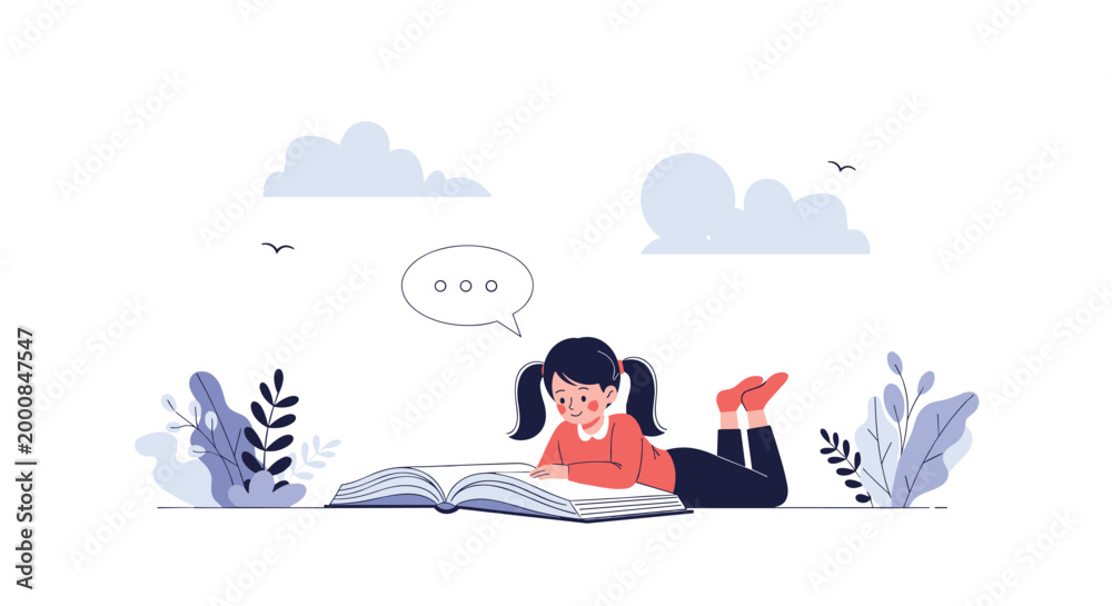 Obraz premium Little girl lies comfortably on her stomach on the floor while being completely absorbed in reading a large storybook.
