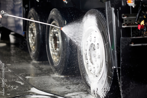 Принти на полотні Professional cleaning of truck wheels and rims using high-quality foam and water services, ensuring a spotless shine
