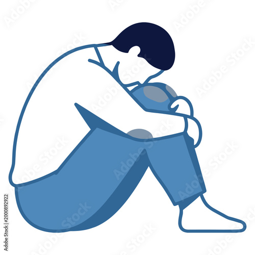 Sad man sitting alone on floor with head down in deep depression feeling.