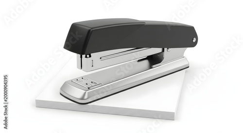 black and silver stapler on white background stapling paper
