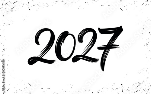 Hand-drawn chalk number 2027 on textured blackboard for new year celebration and future planning