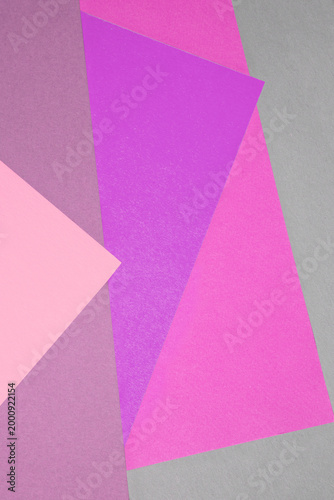 Vibrant geometric arrangement of overlapping colored paper sheets forming a t...