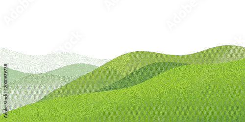 Beautiful green rolling hills landscape with soft grassy meadows under a bright clear sky in springtime