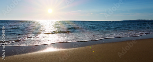 Sun beach with blue sky and turquoise water,as holiday summer background.