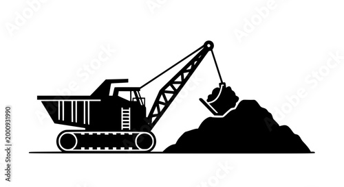 Heavy mining excavator dragline silhouette digging into a dirt pile
