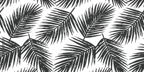 Seamless pattern with black palm leaves for tropical summer design and fashion fabric print wallpaper decor