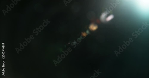 Slow motion cinematic lens flare and light leak effect isolated on black background. Perfect overlay for VFX, transitions, title reveals, film burn style and glow highlights.