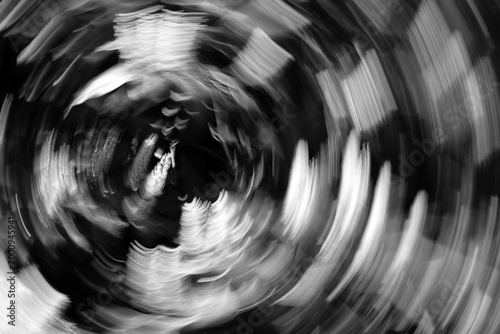 Schilderij op canvas Abstract black and white swirling motion blur background symbolizing anxiety, stress and mental overload