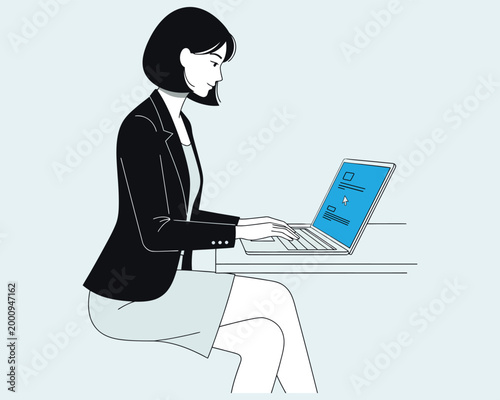 Businesswoman working on a laptop at a desk