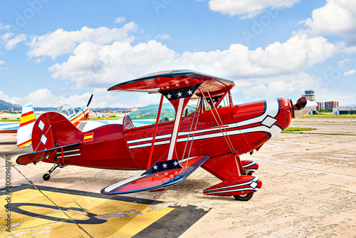Airplane, red light aerobatic biplane. Air shows