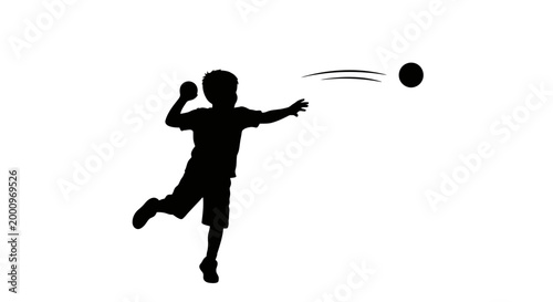 Black silhouette of a young boy throwing a ball.