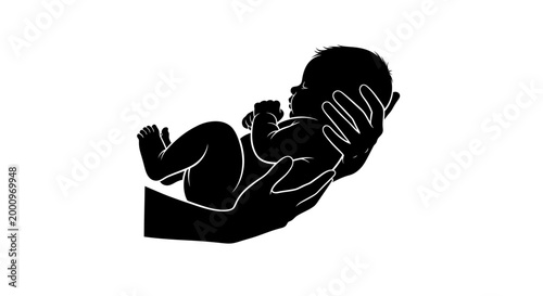 Black silhouette of a newborn baby held in adult hands.