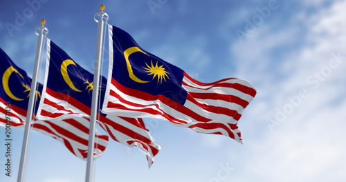 Photography Malaysia national flags waving in the wind on a clear day