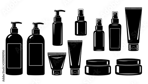 Black cosmetic containers, including bottles, tubes, and jars, arranged in a visually appealing layout, showcasing various shapes and sizes for beauty product packaging mock up