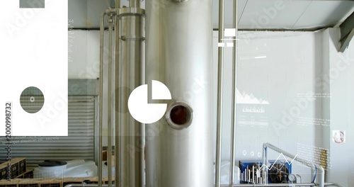 Dominating stainless tank occupying center in plant interior, showing nozzle, pipes, data overlays