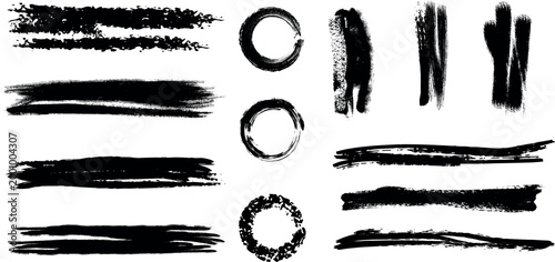 Collection of abstract black brush strokes and oval shapes on a white background