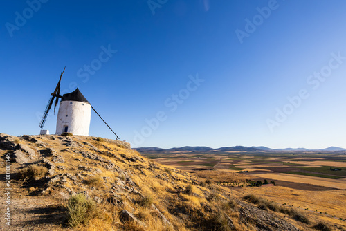 Historic Consuegra windmill standing on a sunny hill