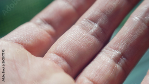 close up of human fingers showing skin texture