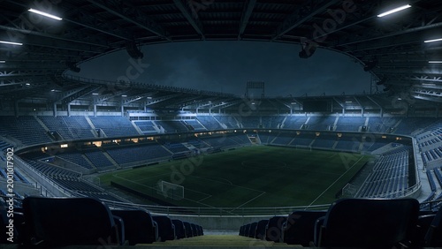 Framing empty soccer pitch and seating bowl under roof canopy, showing floodlights and goals