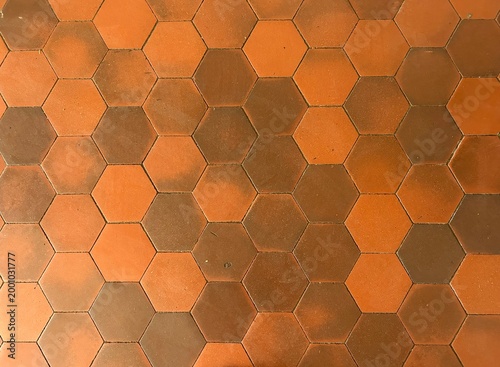 Urban surface and infrastructure texture. Orange hexagonal tile floor pattern.