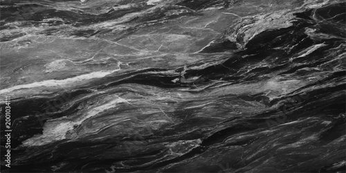 A striking, abstract pattern of layered and textured stone. Capturing the interplay of light and shadow, the image highlights the natural beauty and the subtle details. 