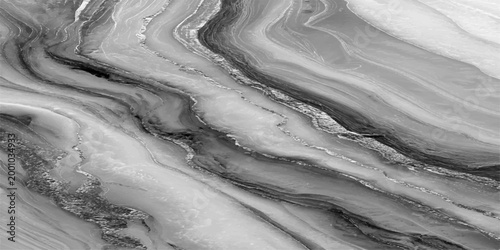 Ethereal grayscale image of marble, revealing flowing patterns, textures, and lines. Capturing the exquisite beauty and intricate details of a natural stone surface. 