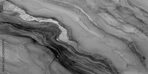 A stunning close-up of a marbled surface with fluid, swirling patterns in monochromatic tones, the image showcasing the natural beauty and intricate detail of the stone's texture.