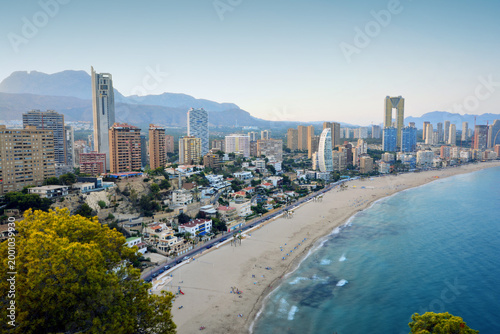 Benidorm, Alicante, Spain, July 24, 2024: Summer day with people sunbathing on Levante beach on a sunny summer day in Benidorm.