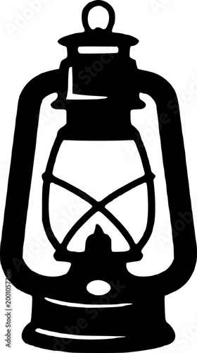 Vintage black metal lantern with handle and glass enclosure, isolated on white background, nostalgic lighting symbol.