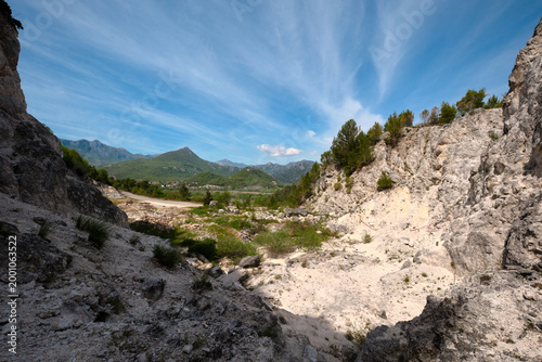 Skadar Lake and mountain ridge seen from limestone ravine in Montenegro spring