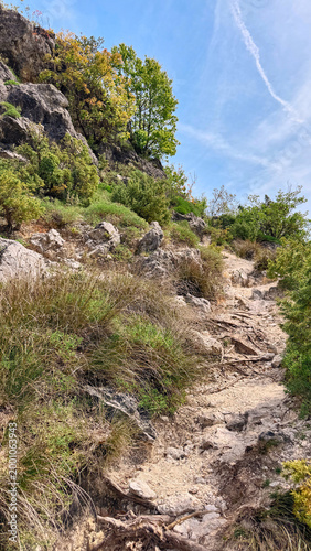 Mountain trail above Skadar Lake on Montenegro ridge in fresh spring light