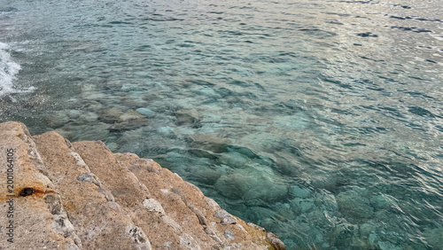 Dobra Voda coastline on Adriatic Sea with clear turquoise water and limestone steps