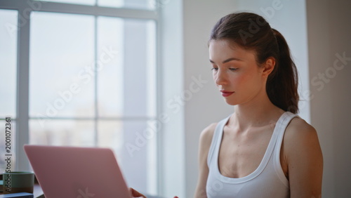 Free Download Closeup woman working laptop at morning light. Relaxed girl closing computer - GFXLoad