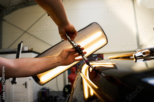 Cold glue pulling technique is used for paintless dent repair.