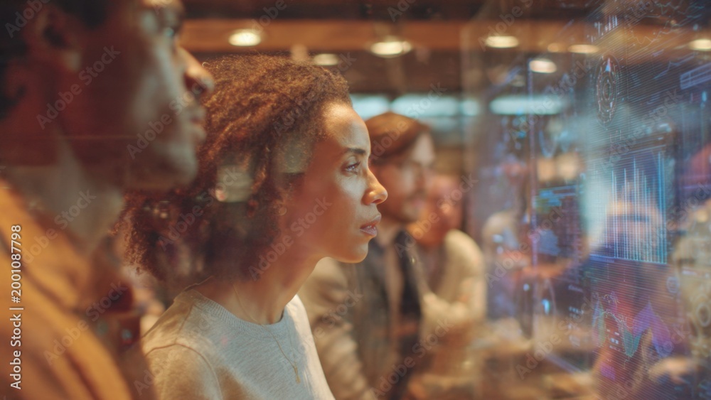 Fototapeta premium Team Analyzing Data on Futuristic Holographic Display
