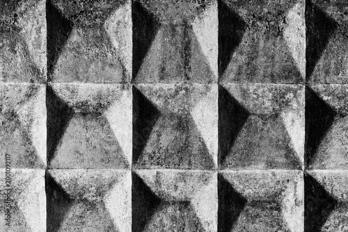 Black and white geometric pattern of a concrete block wall texture