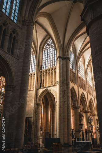 Interior view of a majestic historic Gothic cathedral with tall columns