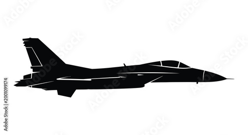 Black silhouette of a modern fighter jet in flight dramatic sky background