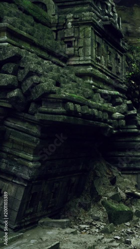 Ancient stones rise from the ground, draped in moss and vines. The jungle envelops the ruins, creating an atmosphere of mystery and forgotten history, especially in the early hours.