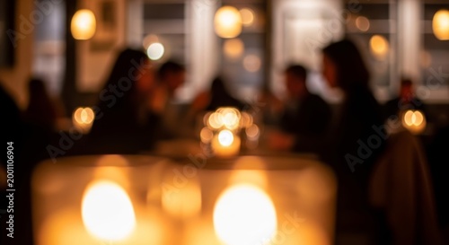 Blurred background of a cozy restaurant with people sitting at tables illuminated by warm candlelight.