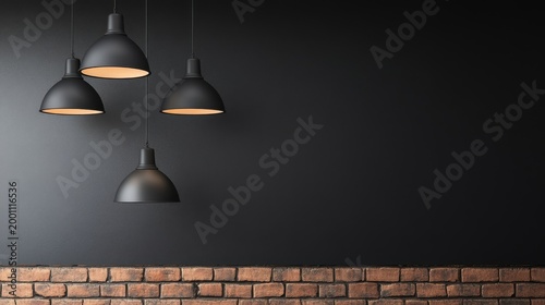 Four black pendant lamps with warm glow against a dark textured wall and rustic brick base, ideal modern industrial backdrop or copy space. Minimalist, interior design